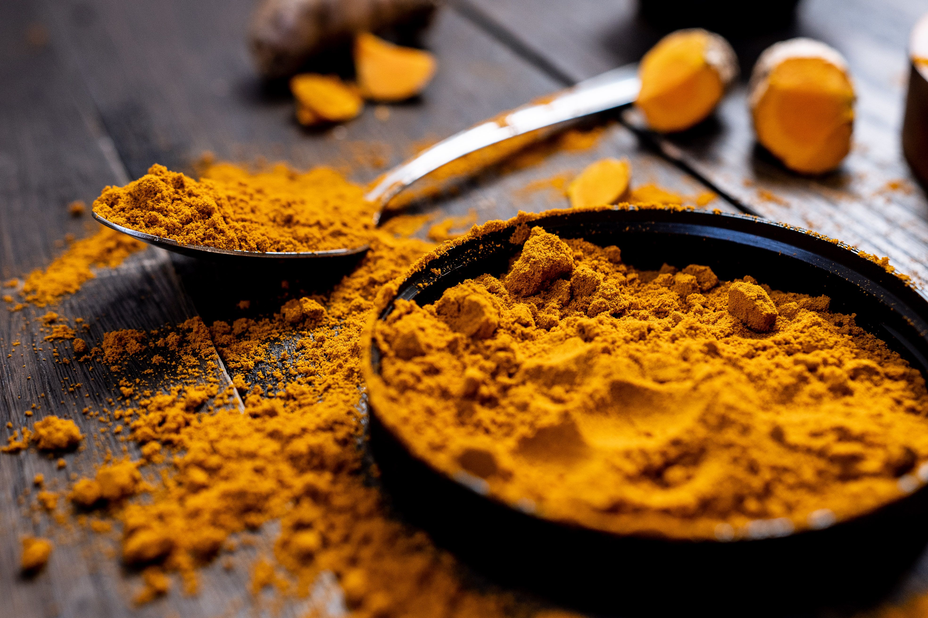Pure Turmeric Roots, Golden Powder and Botanical Blossoms